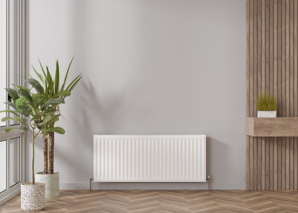 Un radiateur électrique dans une pièce avec une plante
